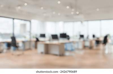 Beautiful blurred background of a light modern Open office full interiors design with indoor plants with Wood plywood floor. Modern Empty Office room blur background