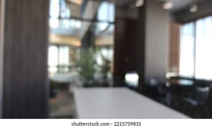 Blur of modern office with open space to work thought the window and background city.