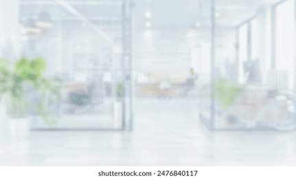 Blurred empty open space office. Abstract light bokeh at office interior background for design.