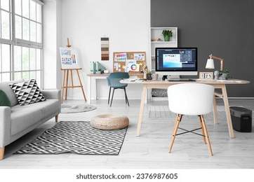 Interior designer's workplace with computer in office