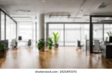 Light blur Minimalist Open Space Office background. Blurred Modern contemporary office and meeting room, interior design. with panoramic glass windows and green plant inside and Wooden floor